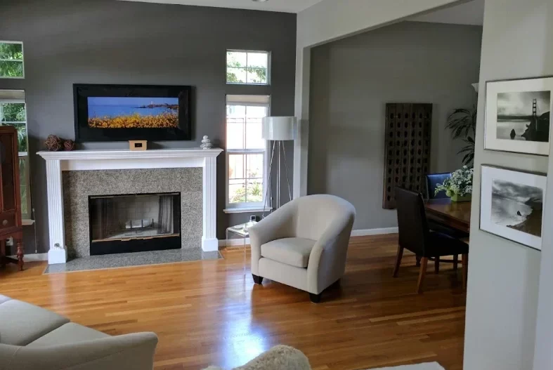 Painting company in Austin, TX completing a living room project with freshly painted walls, fireplace, and modern finishes.