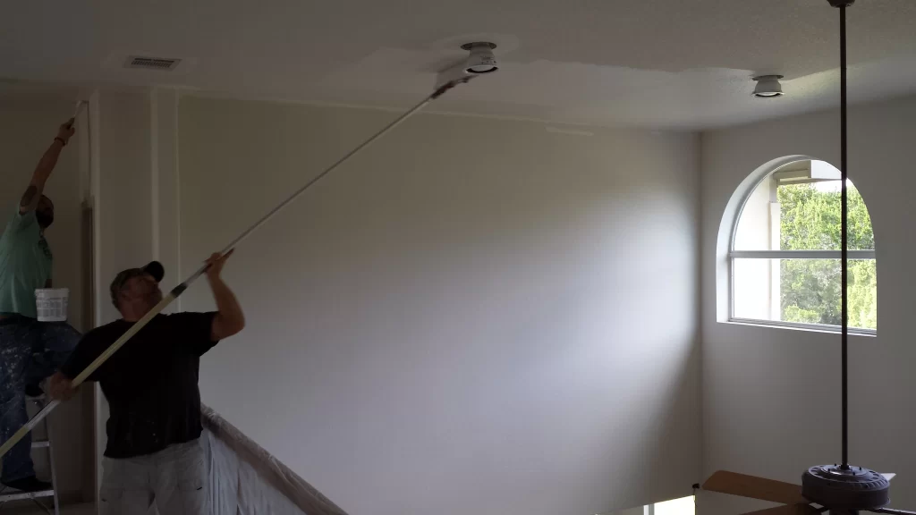 Professional painters in Austin, TX performing interior painting work in progress