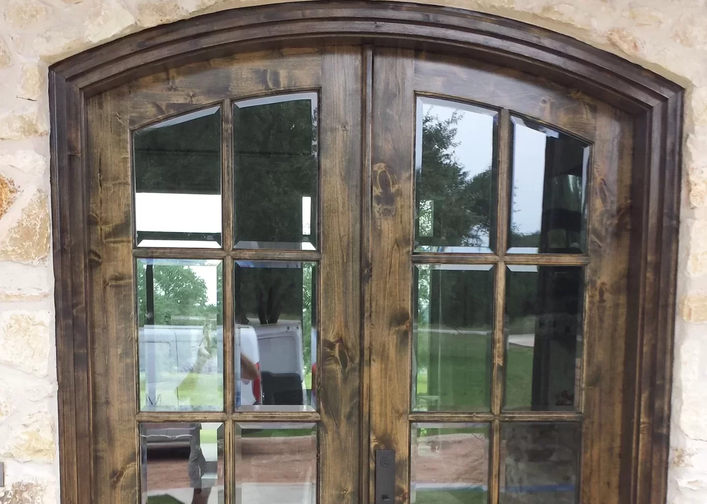 Refinished mahogany front door in Austin, TX with restored shine and durability